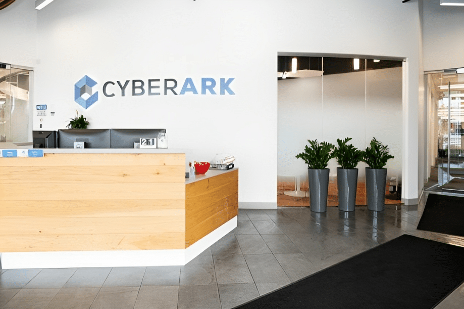 CyberArk office space with a receptionist desk and logo sign on the wall.